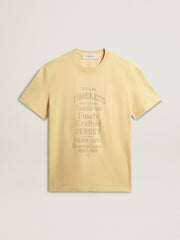 Men's cotton T-shirt in pale yellow with faded lettering