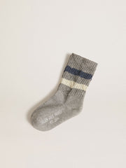 Kids’ gray socks with distressed details and worn-white and blue stripes