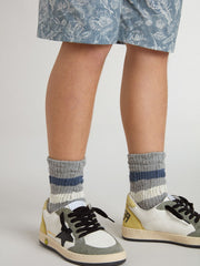 Kids’ gray socks with distressed details and worn-white and blue stripes