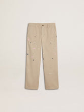 Kids’ beige chino pants with multicolor splashes