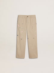 Kids’ beige chino pants with multicolor splashes