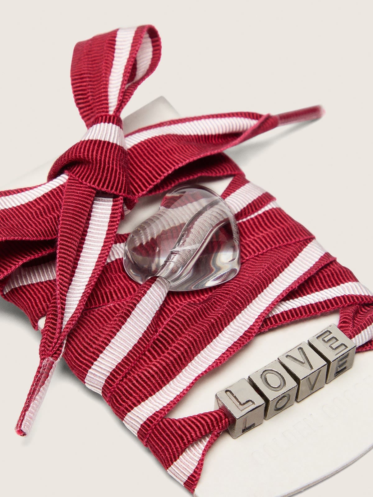 Skins red and white striped laces with charms