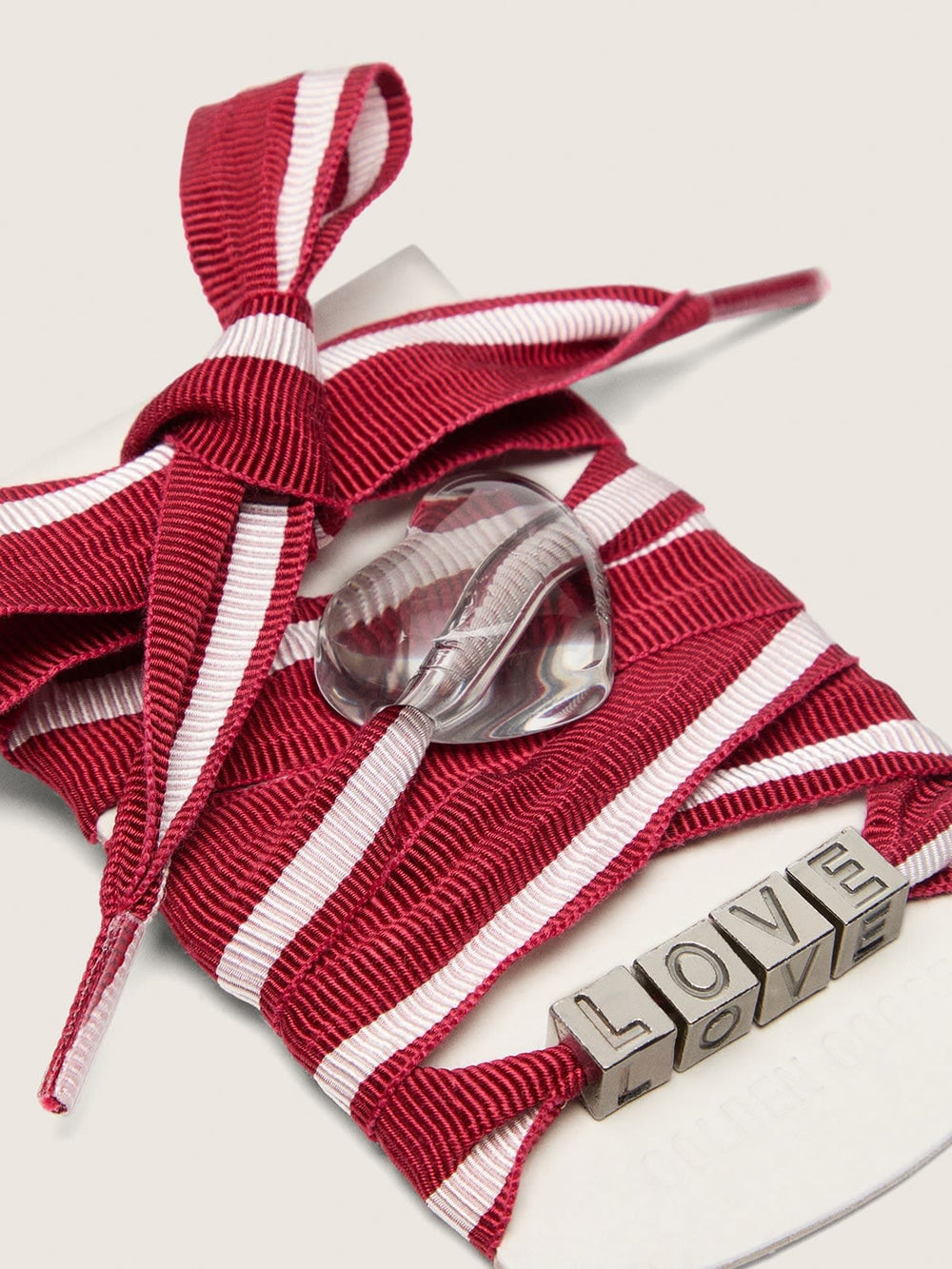 Skins red and white striped laces with charms