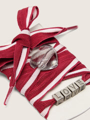 Skins red and white striped laces with charms