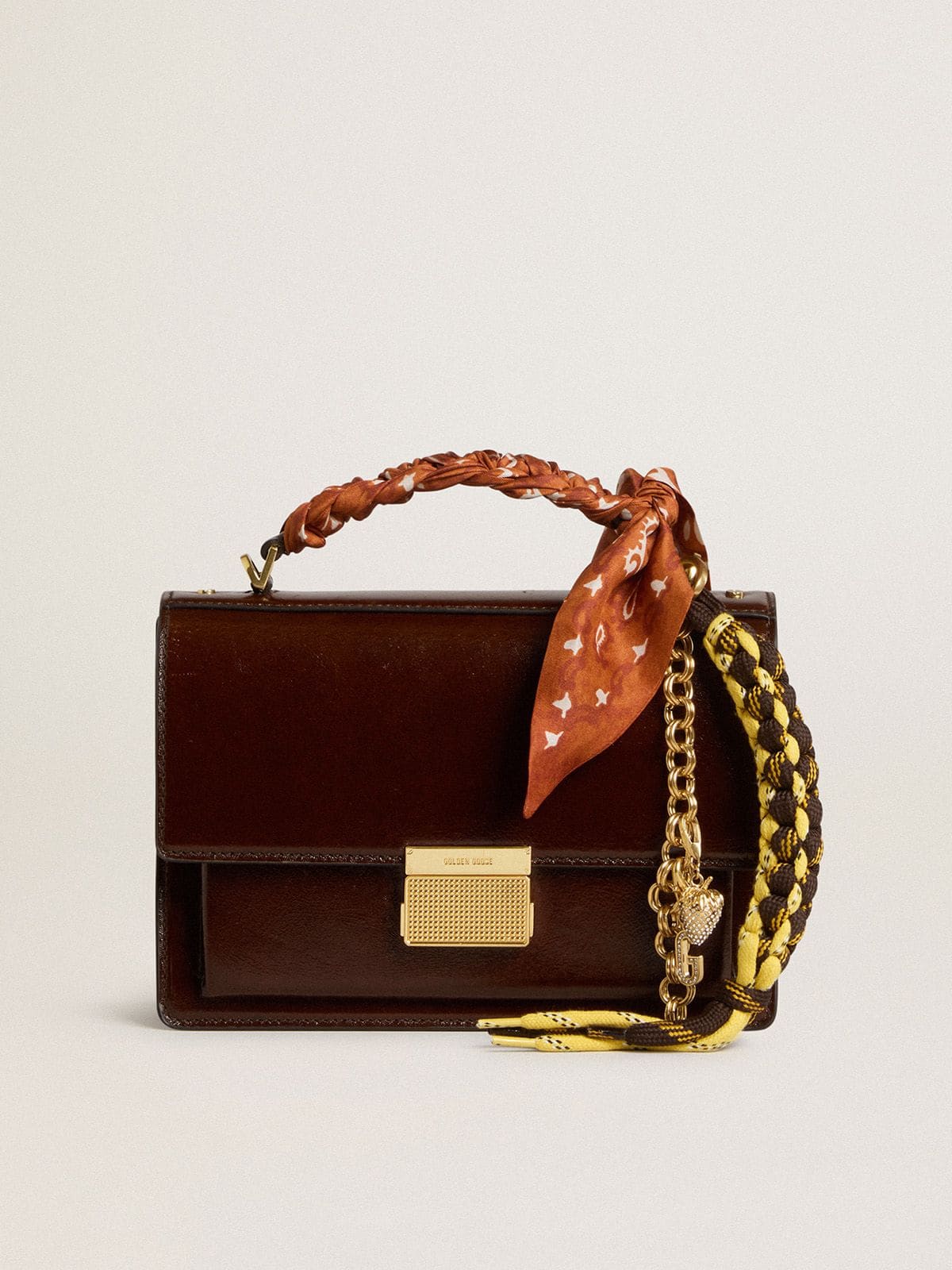 Charm with yellow and brown knotted hiking laces with chain