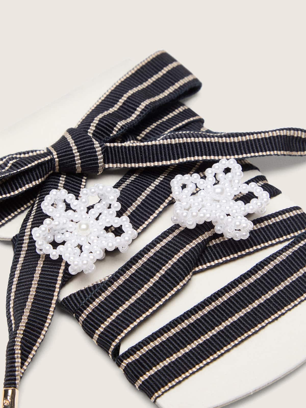 Skins white and dark blue striped laces with beaded charms