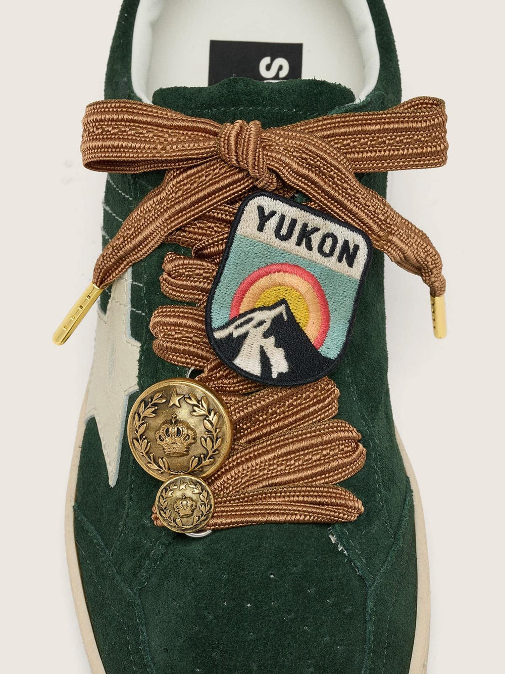 Skins burgundy and peach embroidered laces with patch and two charms