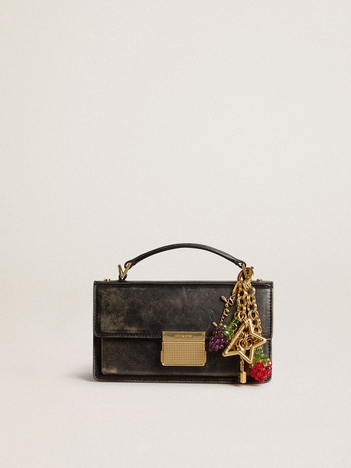 Gold-colored brass charm with Golden Goose signature