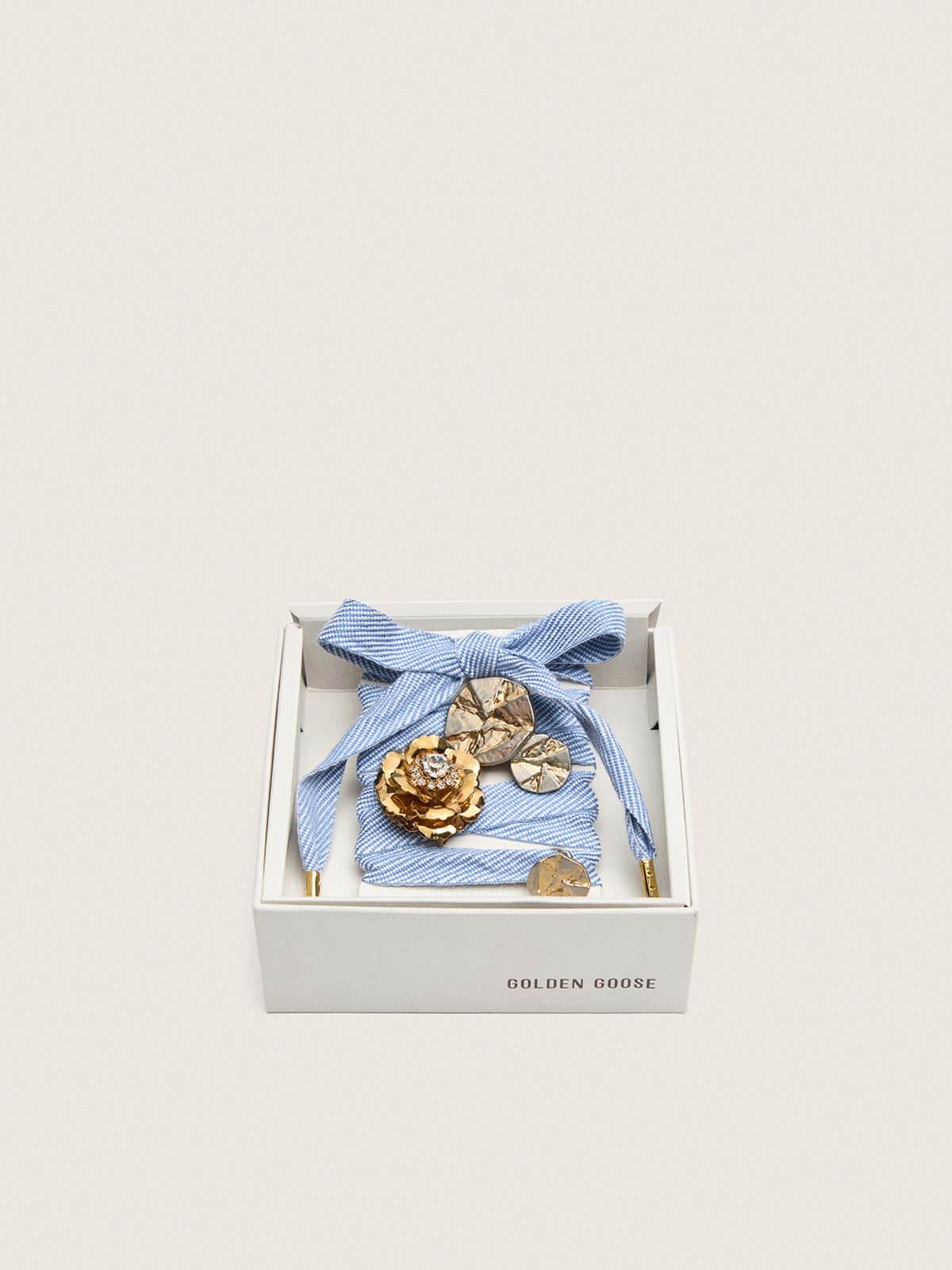 Skins light blue and white herringbone laces embellished with charms