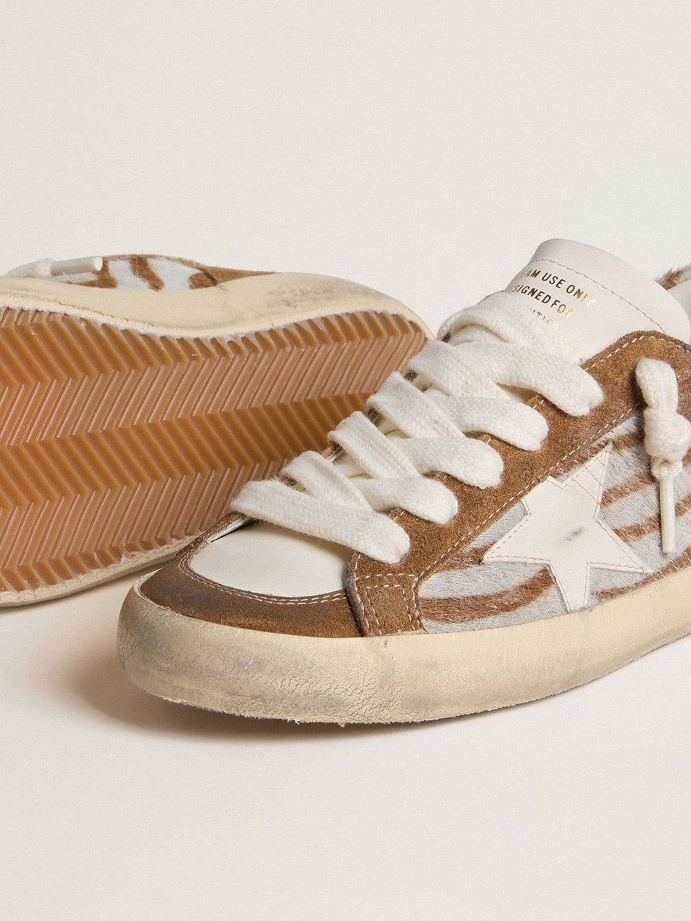 Women's Super-Star in zebra-print pony skin with leather star and brown suede inserts