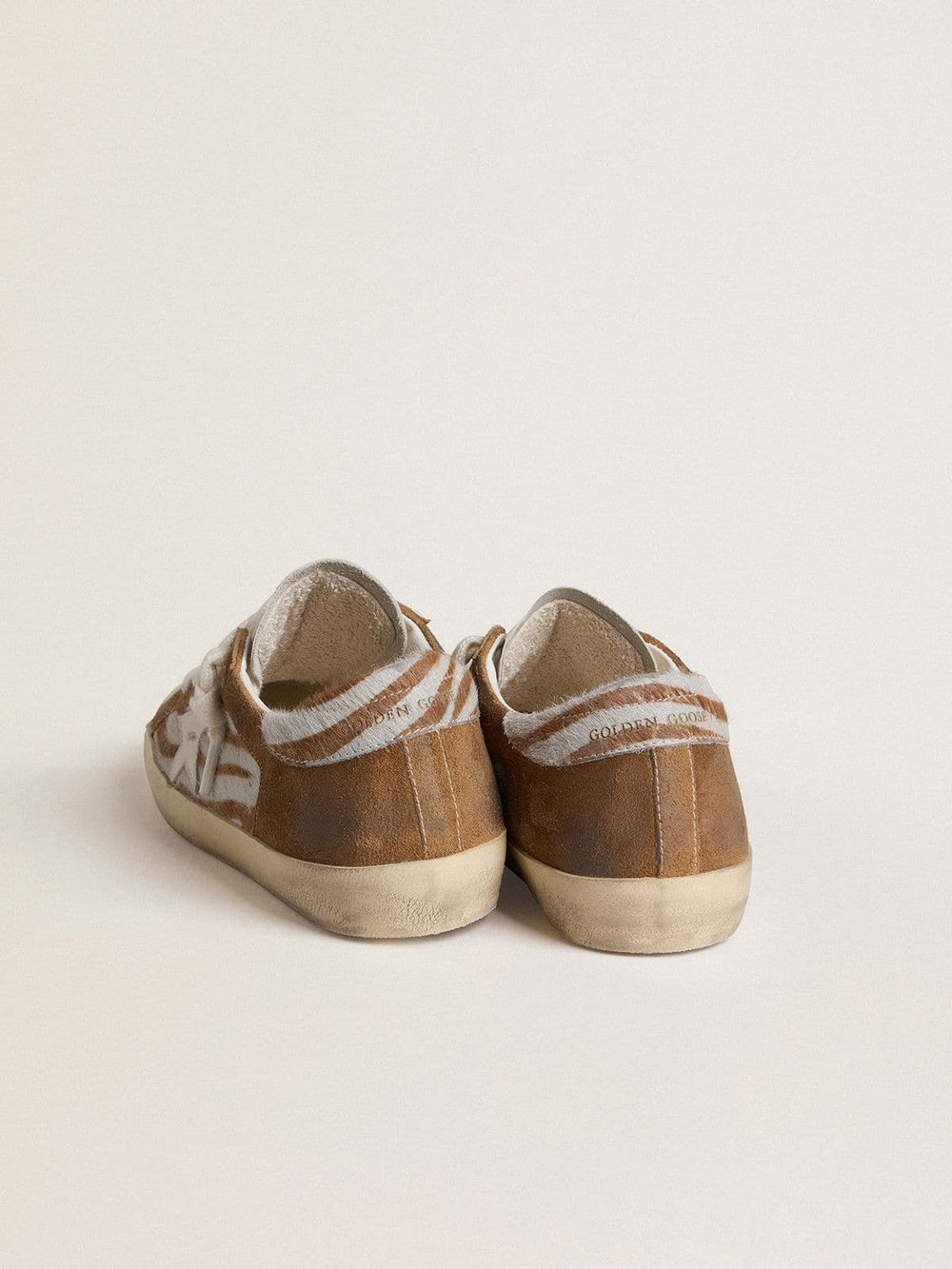 Women's Super-Star in zebra-print pony skin with leather star and brown suede inserts