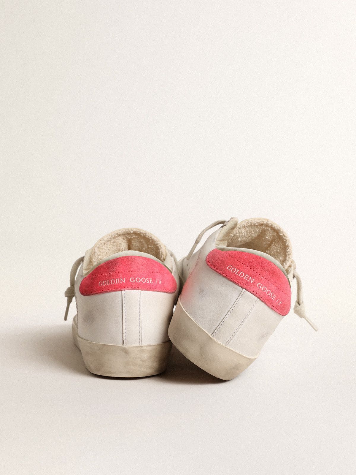 Women's white leather Super-Star with perforated star and fuchsia nylon heel tab