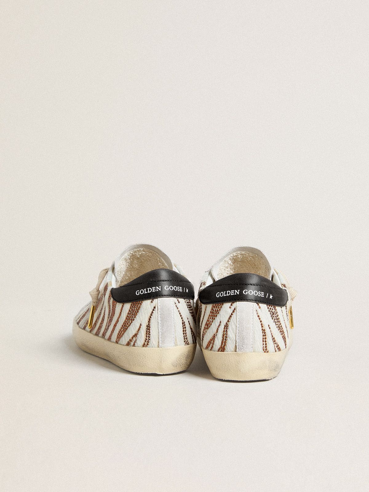 Women’s Super-Star LTD in white pony skin with brown glitter and white suede star