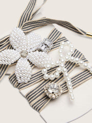 Skins black and beige striped laces with beaded and sparkling charms