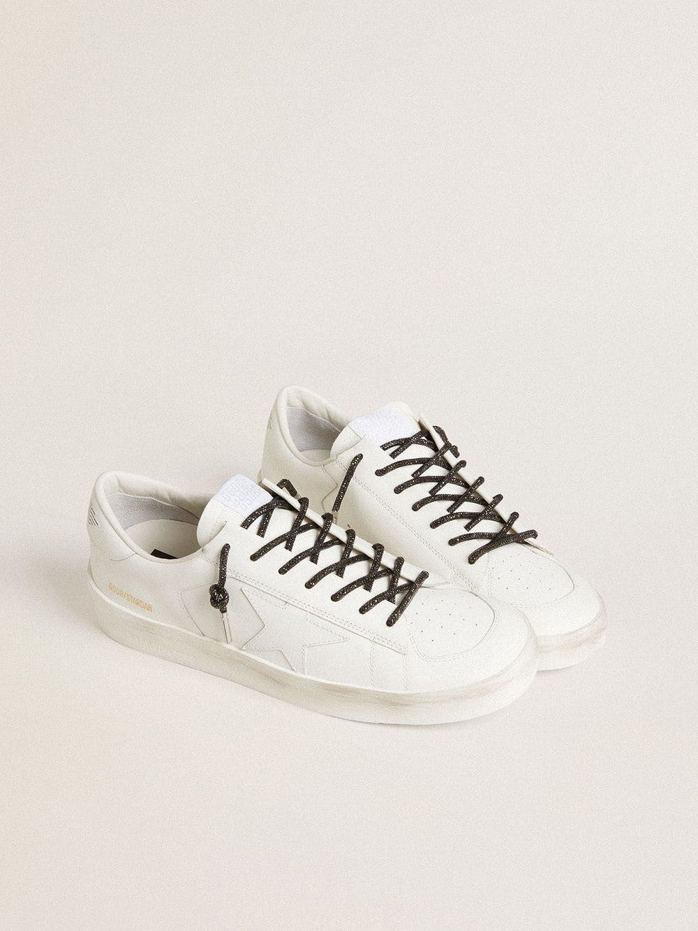 Black laces with silver-colored Swarovski rhinestones