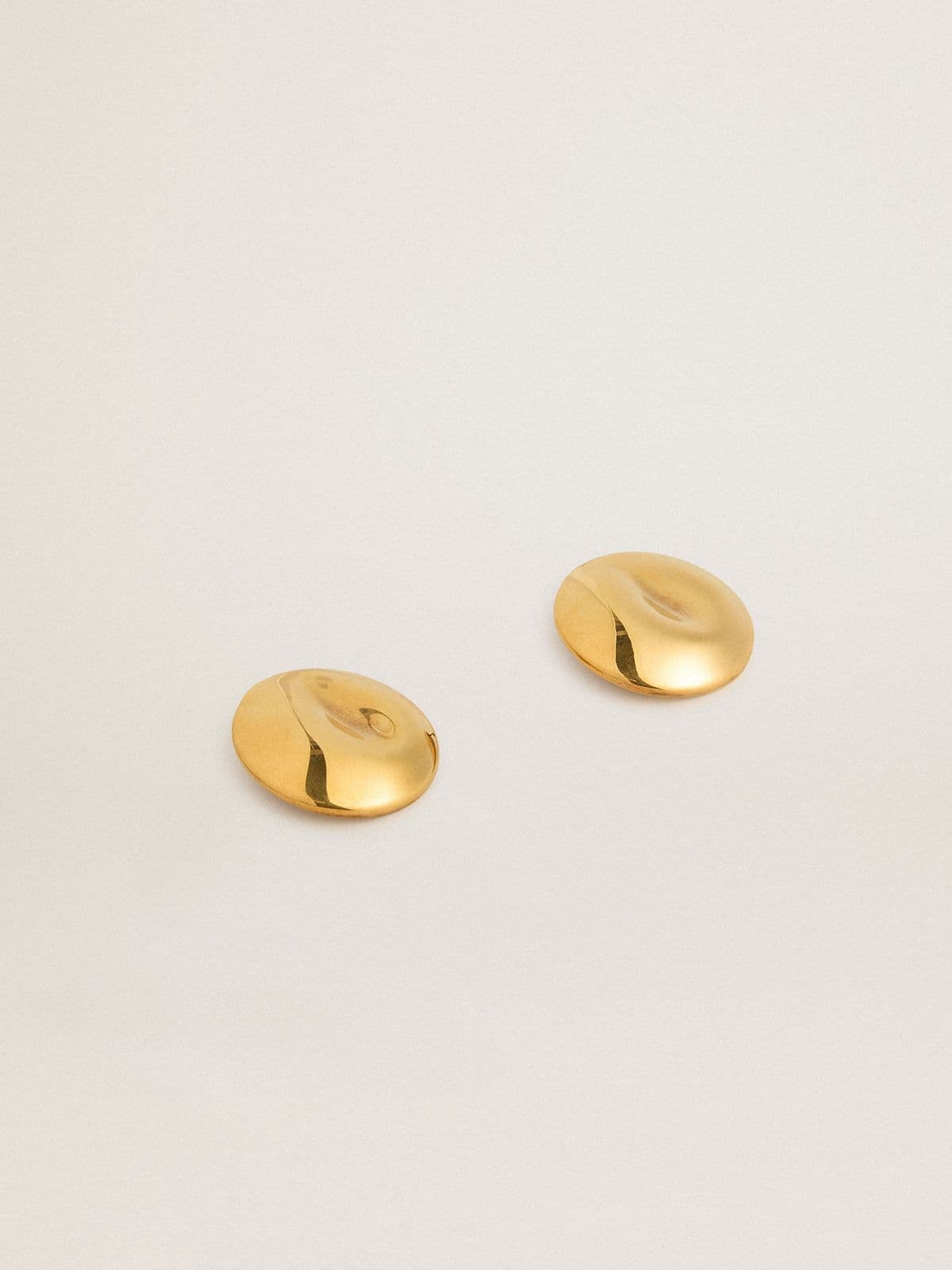Gold circular earrings