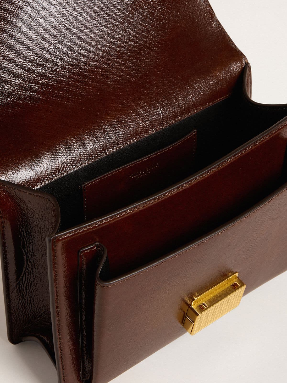 Venezia Bag in dark brown laminated leather with gold details