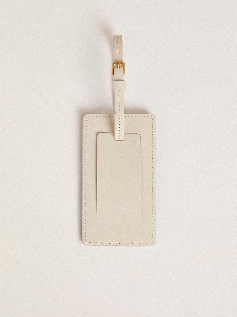 Worn white luggage tag