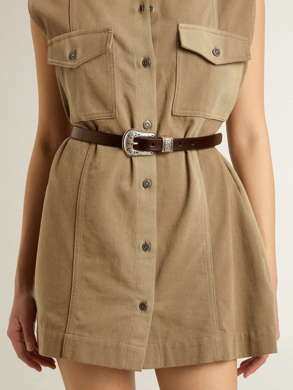 Women's dark brown leather belt with decorated silver buckle