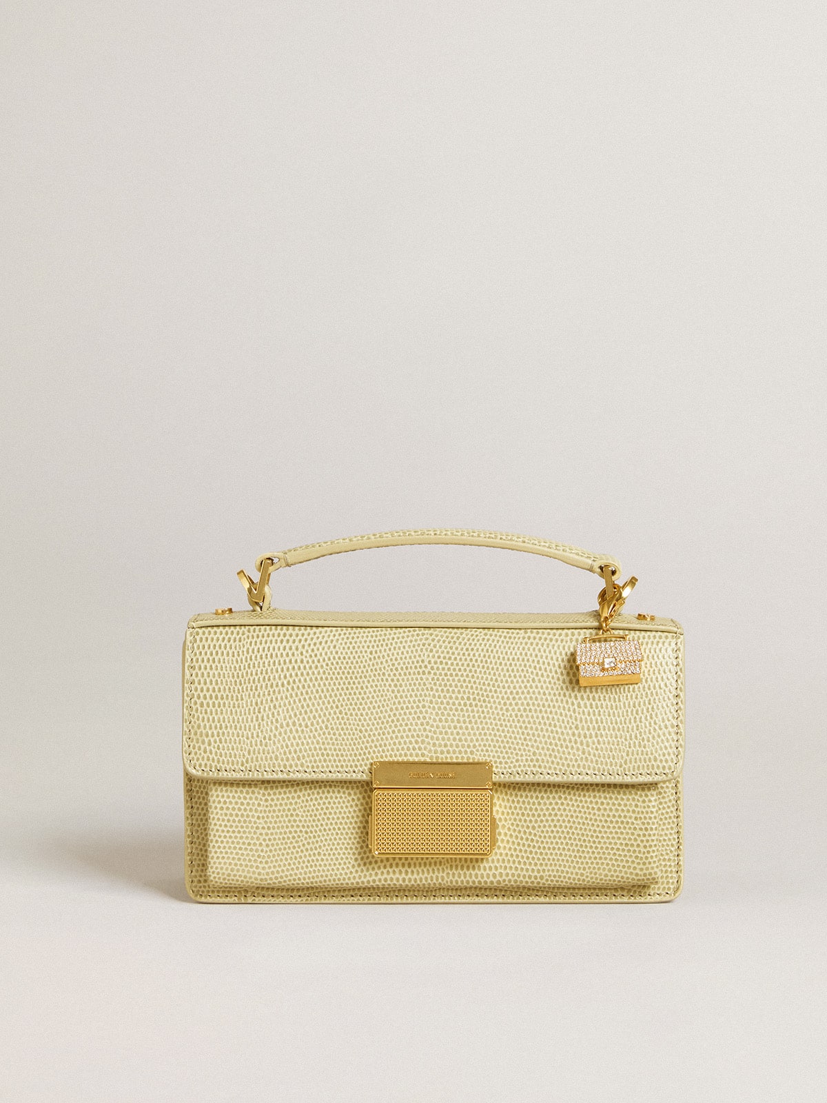 Purse-shaped charm in gold-colored brass with crystals