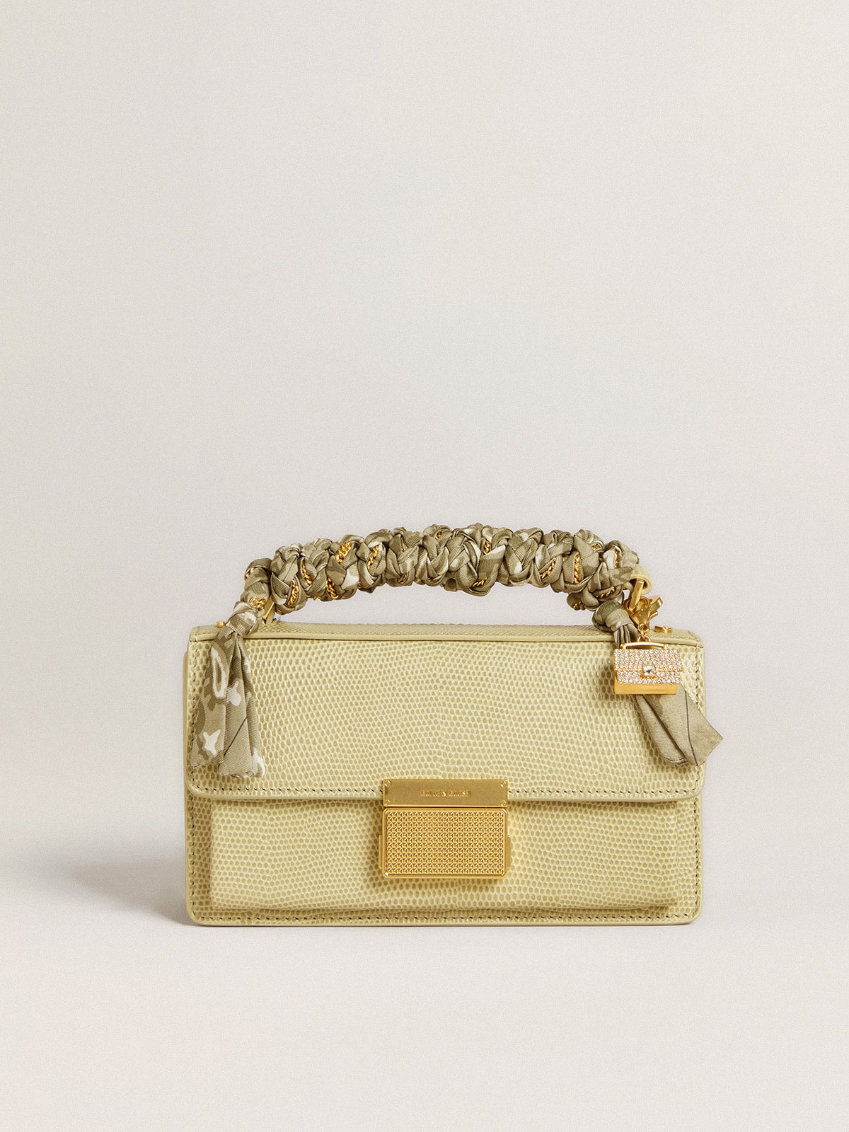 Purse-shaped charm in gold-colored brass with crystals