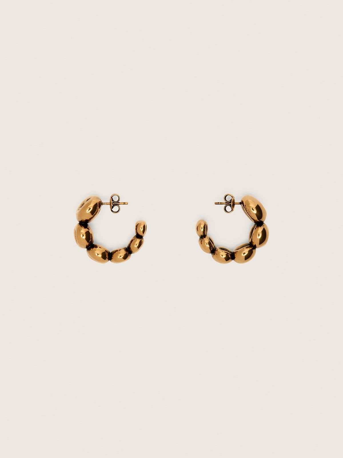 Hoop earrings with antique gold-colored studs