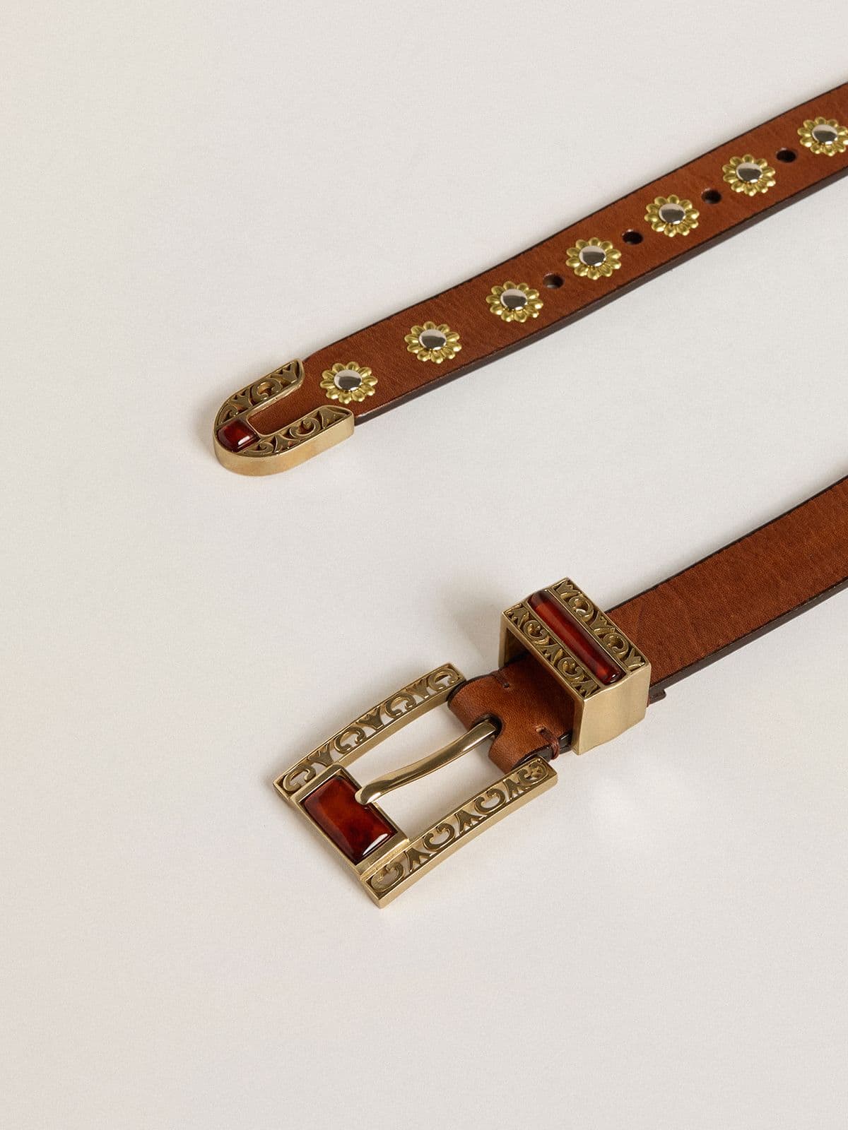 Brown leather belt with golden floral studs and amber inserts