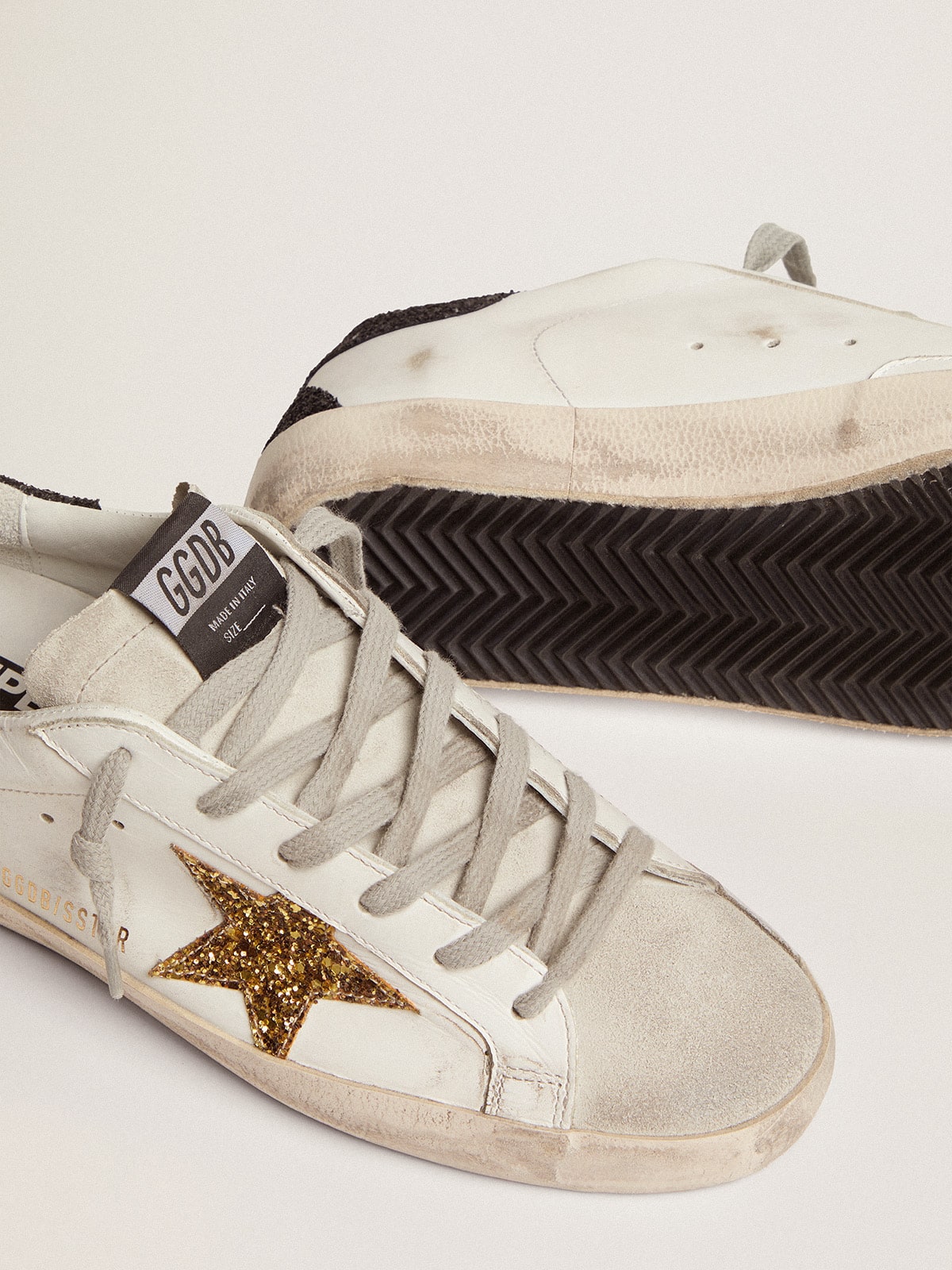 Women’s Super-Star in nappa leather with gold glitter star and black glitter heel tab