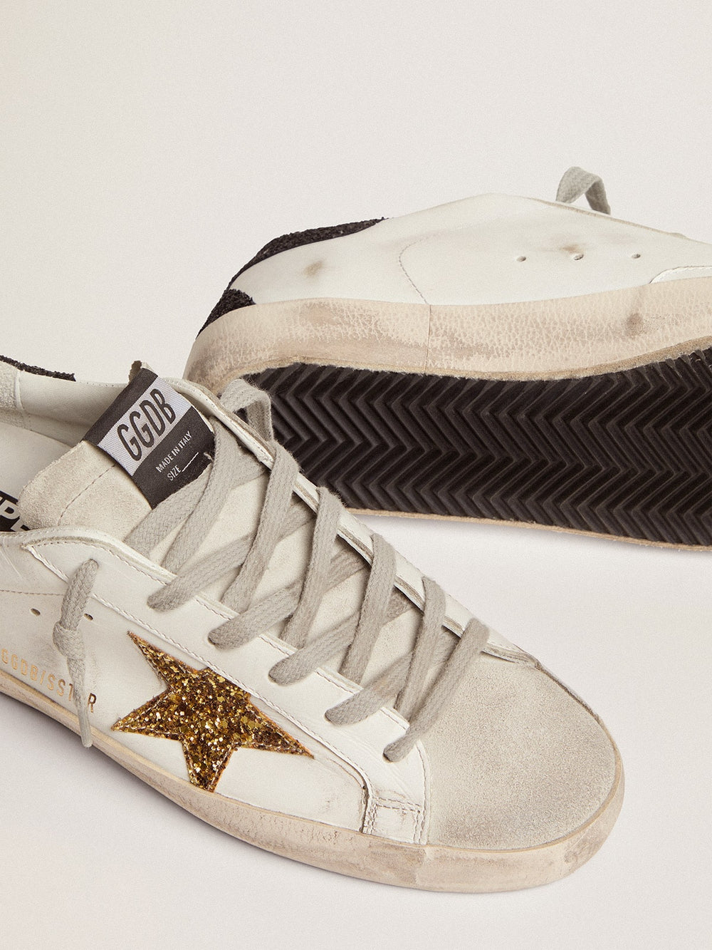 Women’s Super-Star in nappa leather with gold glitter star and black glitter heel tab