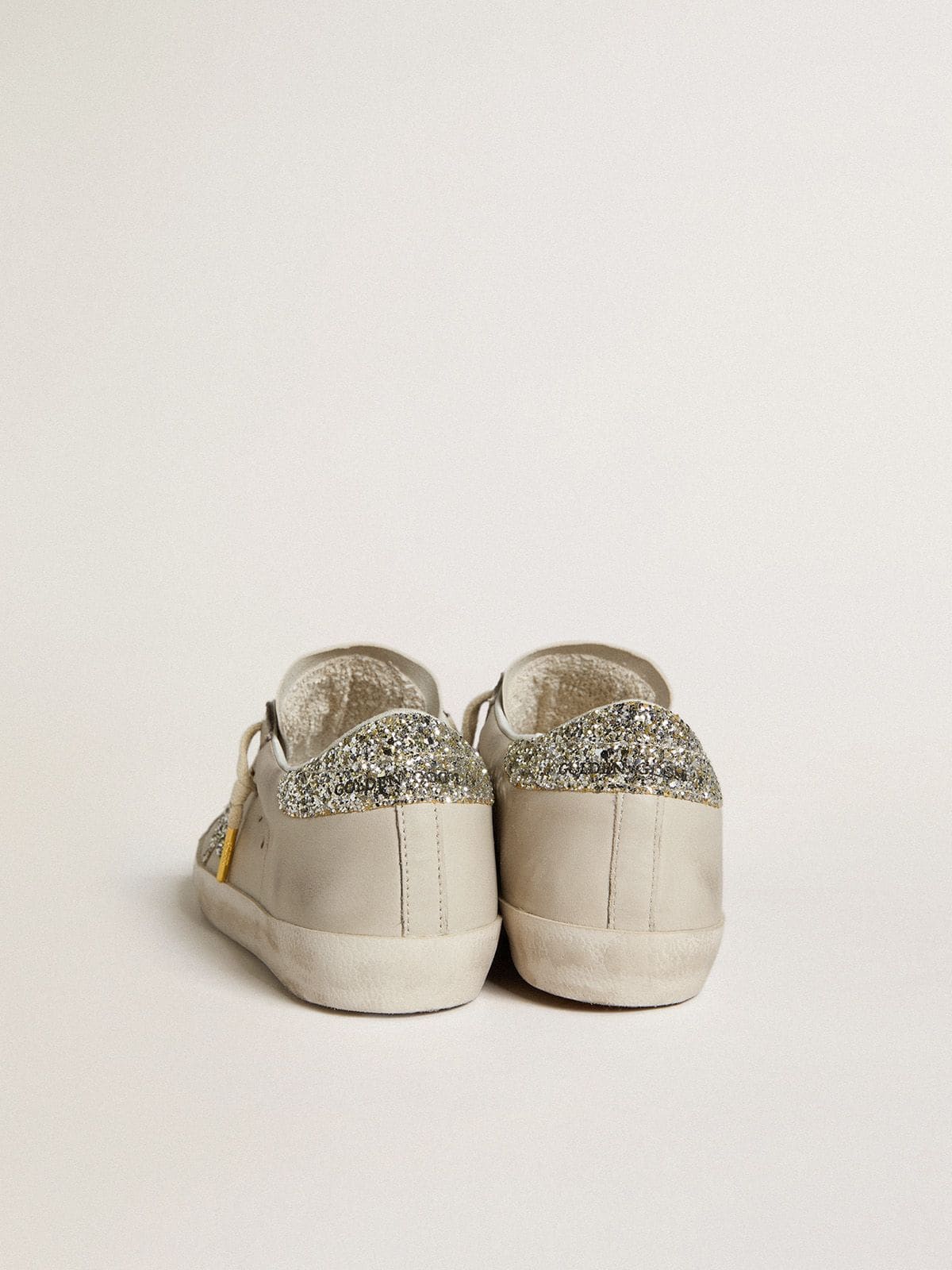 Women's Super-Star in ivory nappa leather with platinum glitter star and heel tab
