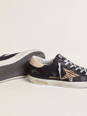 Women’s Super-Star in black nappa leather with zebra-print pony skin star and beige leather heel tab