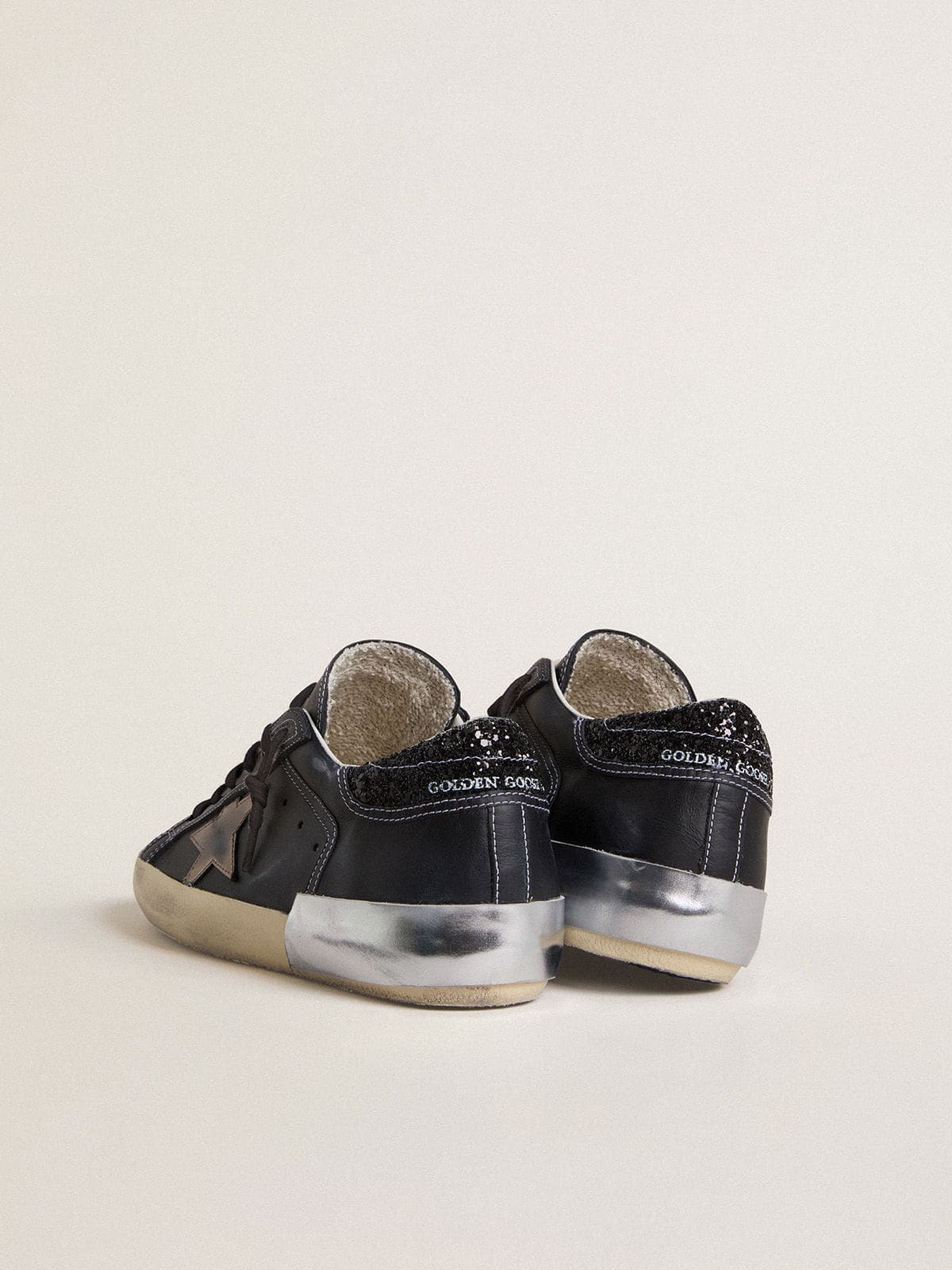Women's Super-Star LTD in black leather with gold leather star and black glitter heel tab