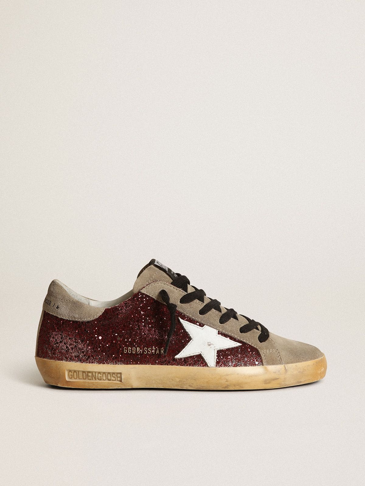 Women's Super-Star in burgundy glitter with white leather star and dove-gray suede tongue