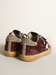 Women's Super-Star in burgundy glitter with white leather star and dove-gray suede tongue