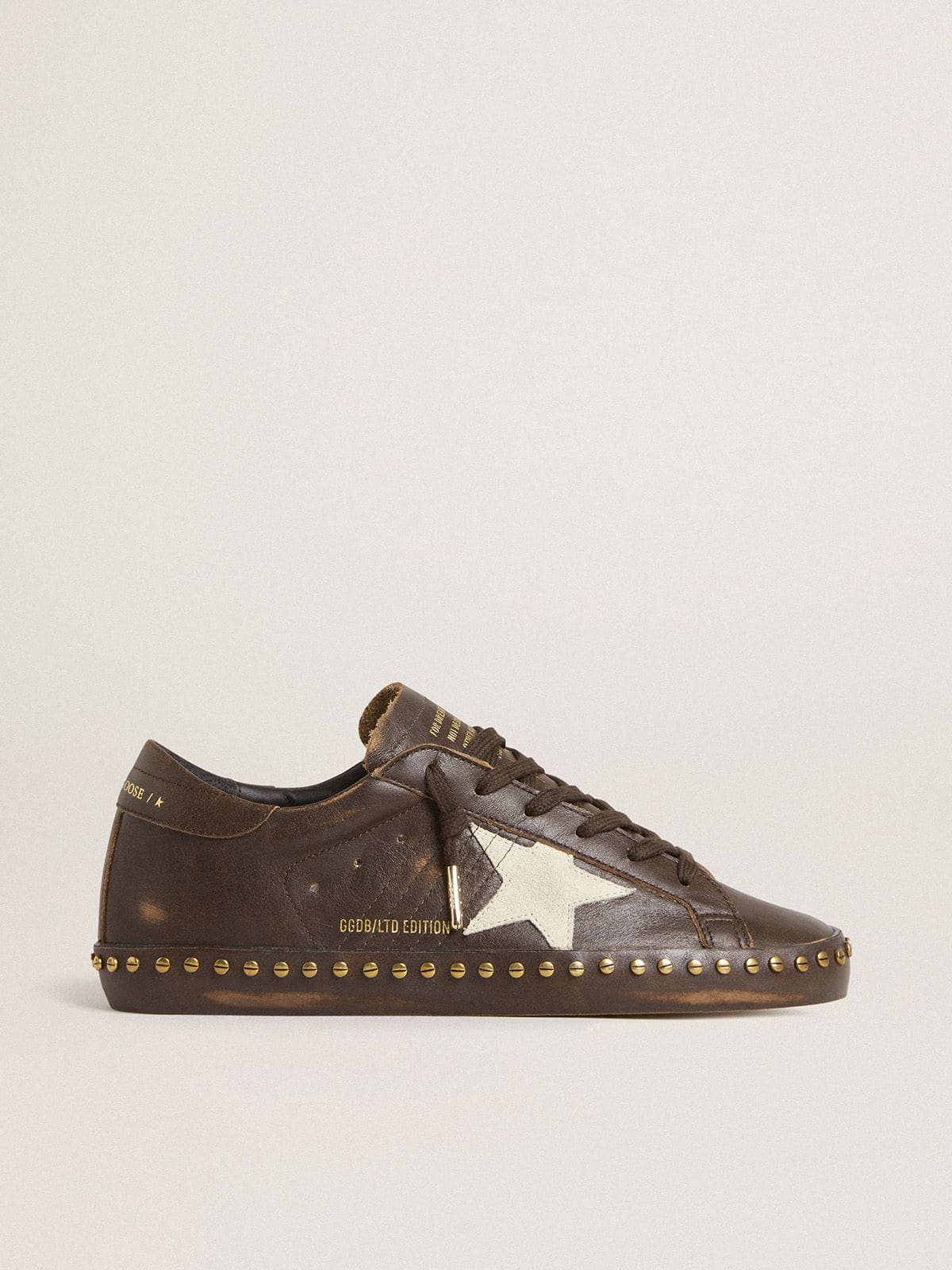 Women’s Super-Star LTD in dark brown leather with cream suede star and studs