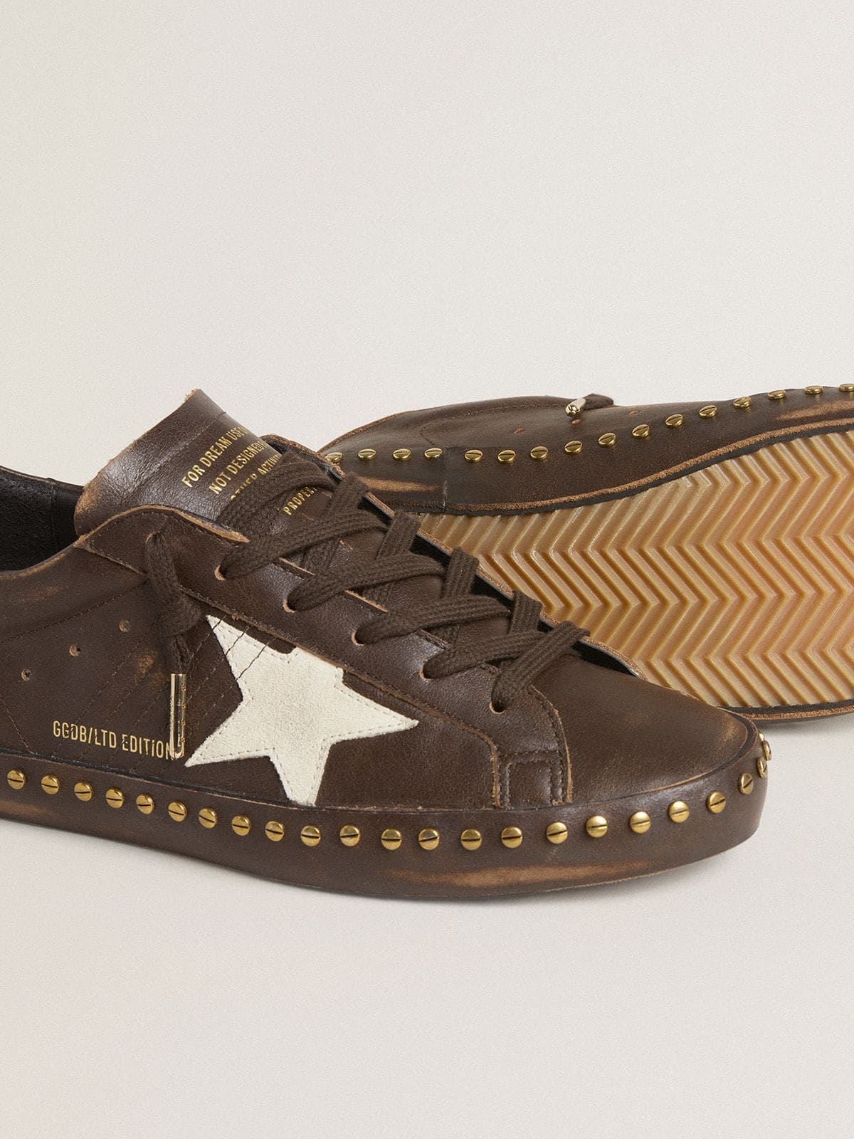 Women’s Super-Star LTD in dark brown leather with cream suede star and studs