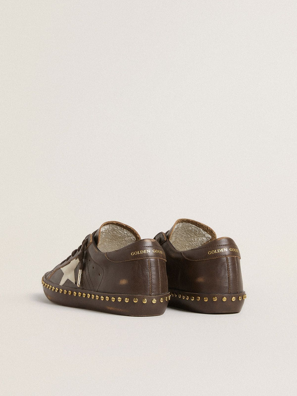 Women’s Super-Star LTD in dark brown leather with cream suede star and studs