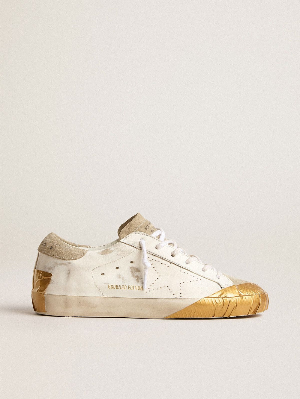 Women's Super-Star LTD in white leather with ice-gray suede inserts and gold-colored tape