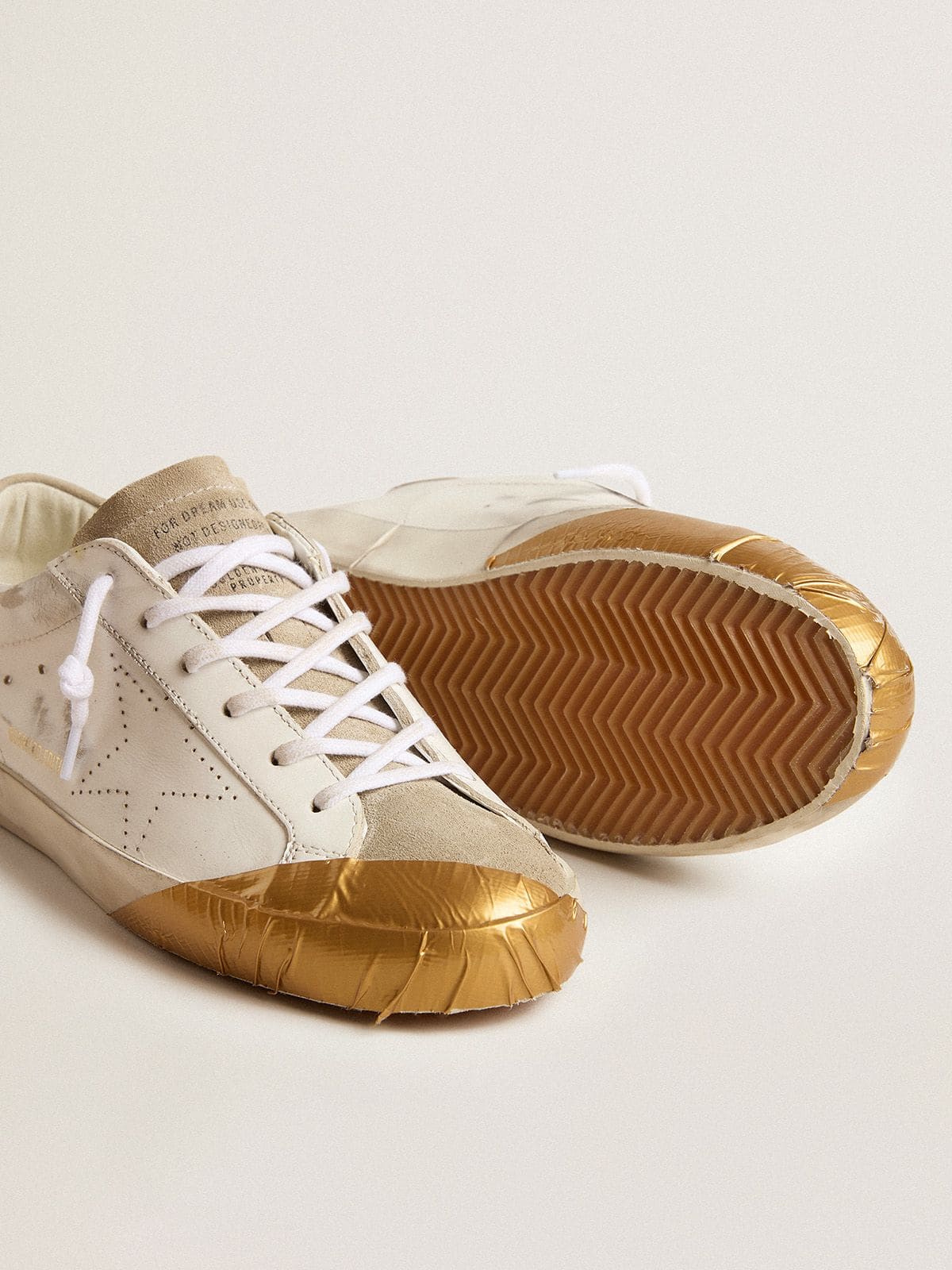 Women's Super-Star LTD in white leather with ice-gray suede inserts and gold-colored tape
