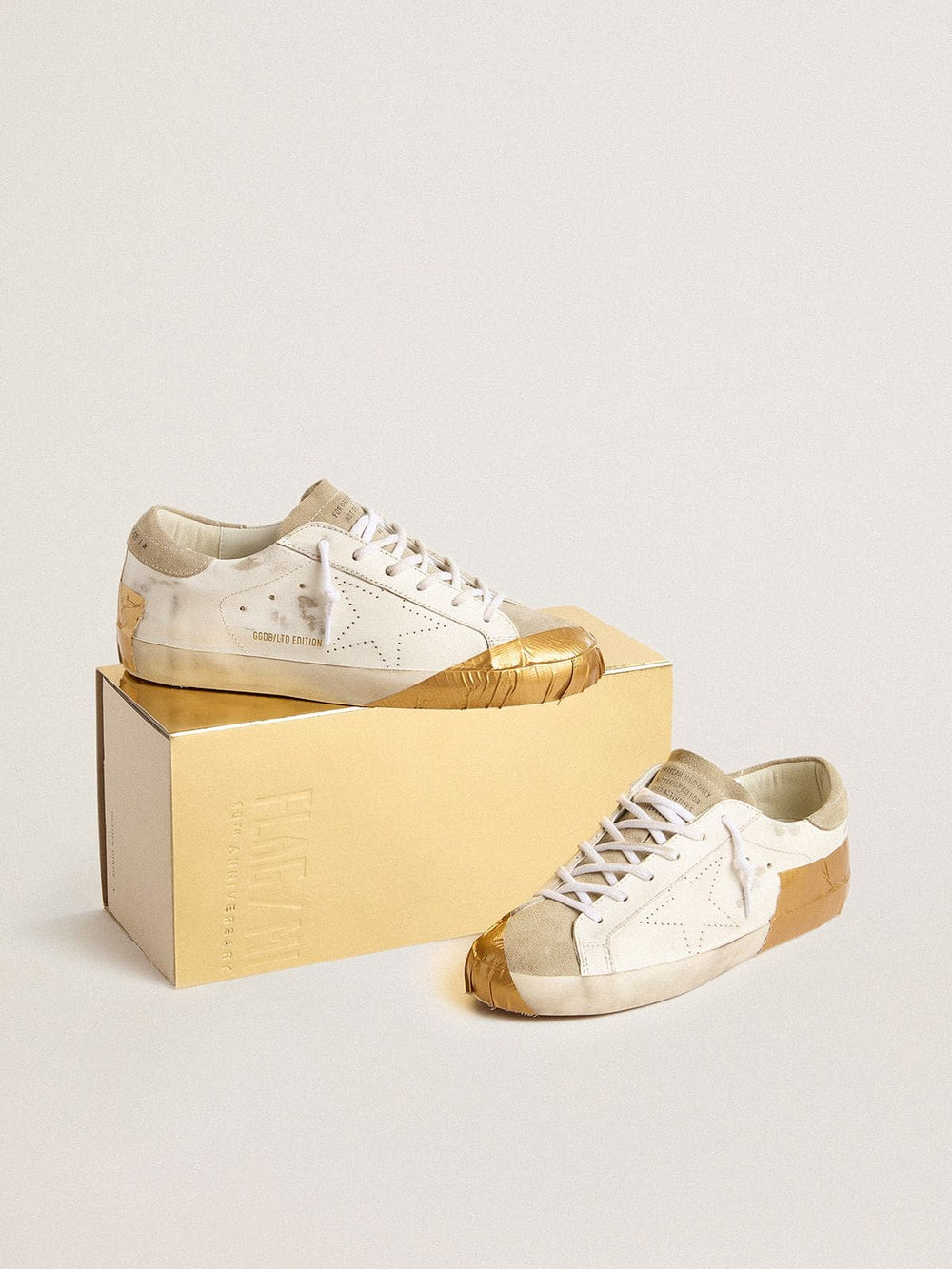 Women's Super-Star LTD in white leather with ice-gray suede inserts and gold-colored tape