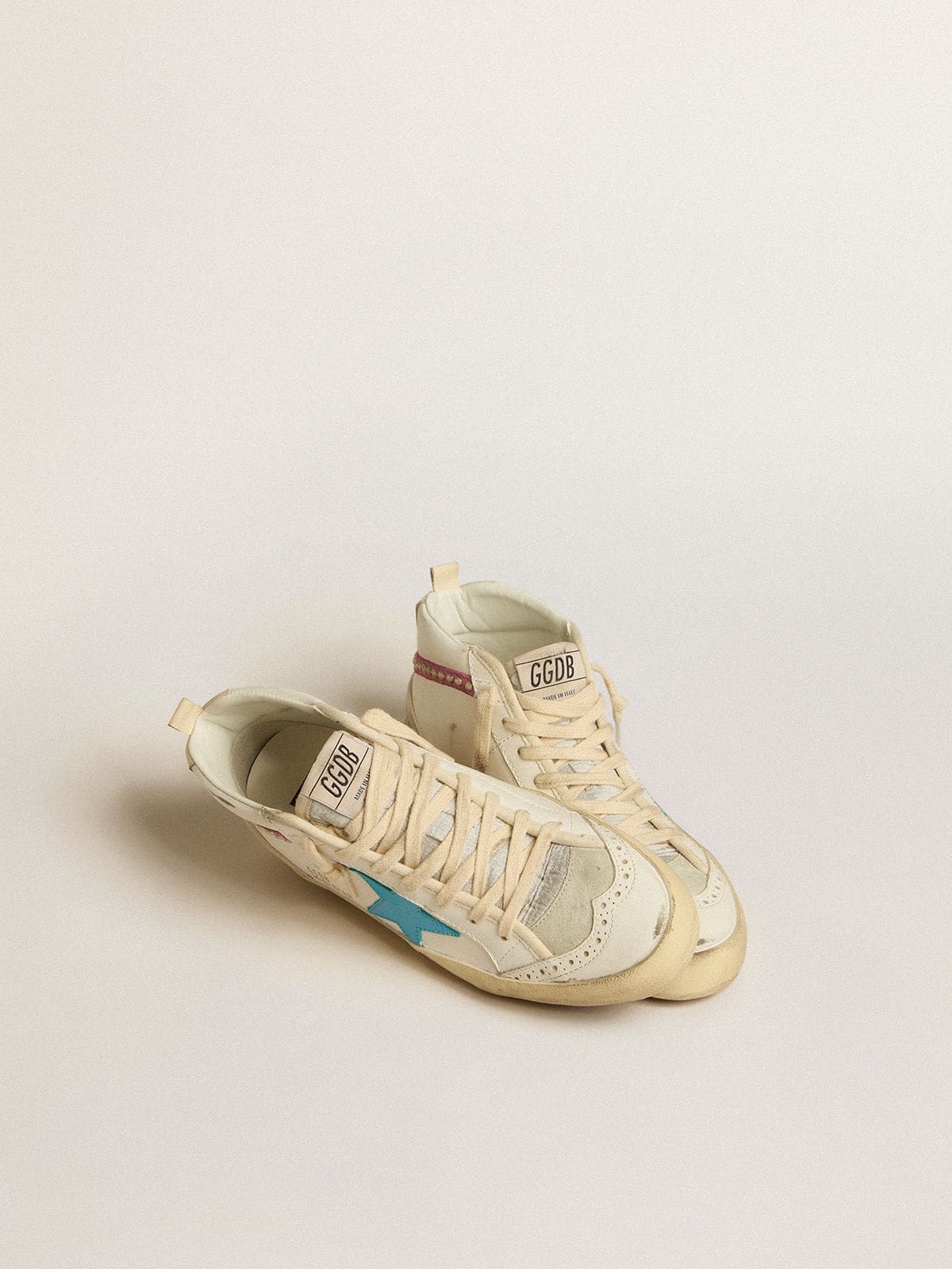 Women's Mid Star in leather with light blue star and fuchsia suede flash with platinum studs