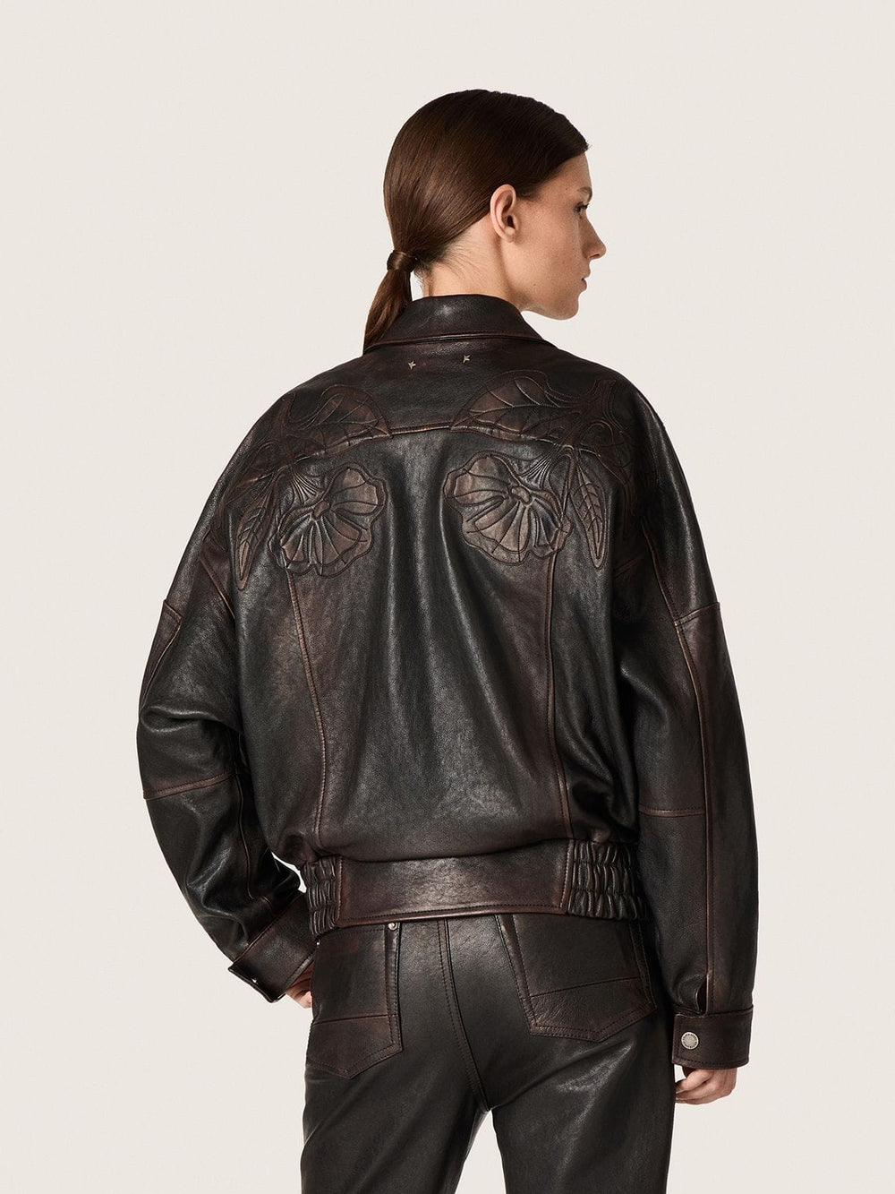 Women's bomber jacket in dark burgundy nappa leather with floral embroidery