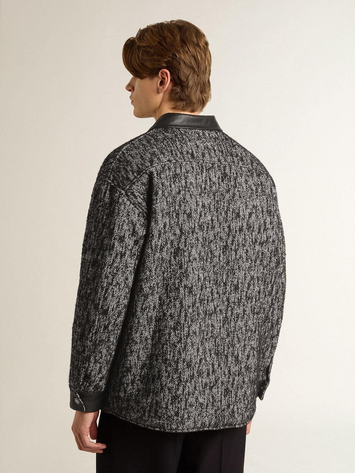 Gray herringbone jacket with black leather details