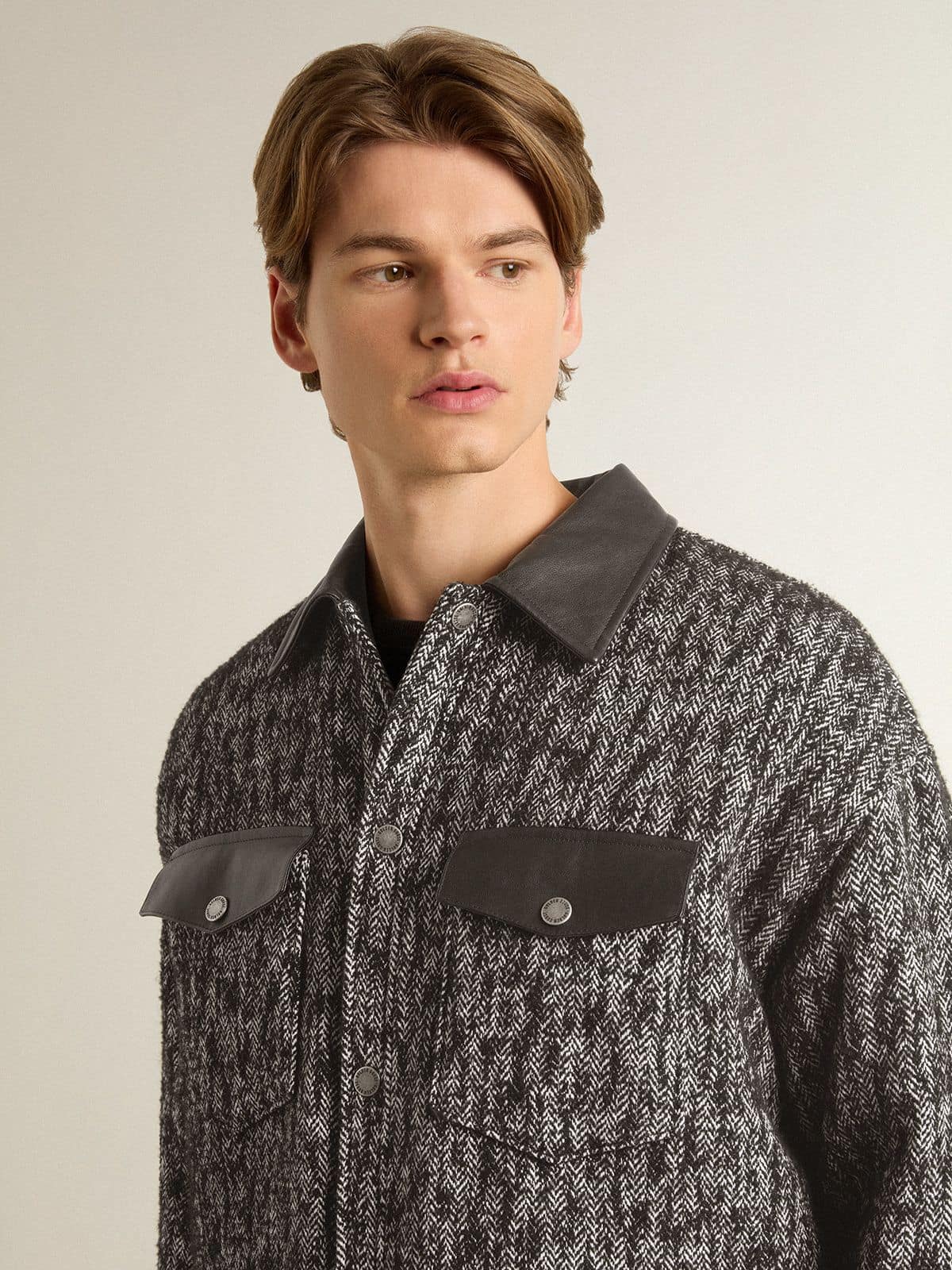 Gray herringbone jacket with black leather details