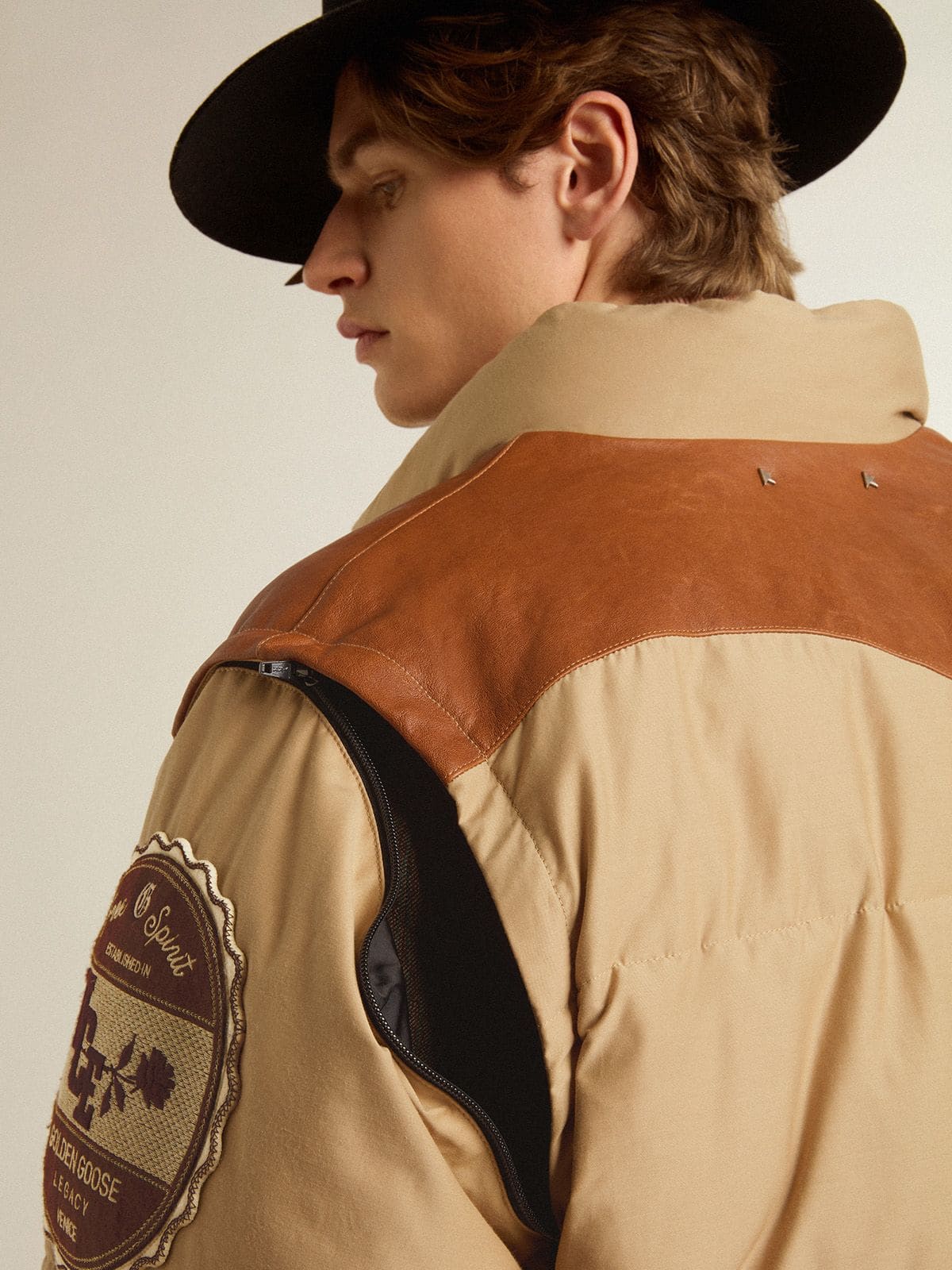 Beige bomber jacket with leather and patch details