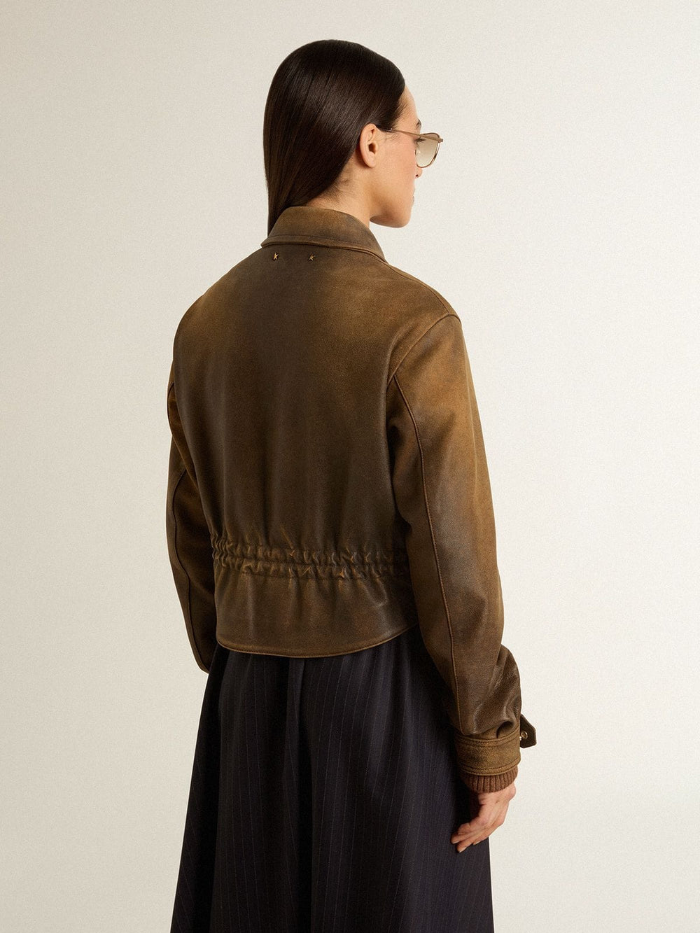 Women’s cropped brown leather biker jacket with zip