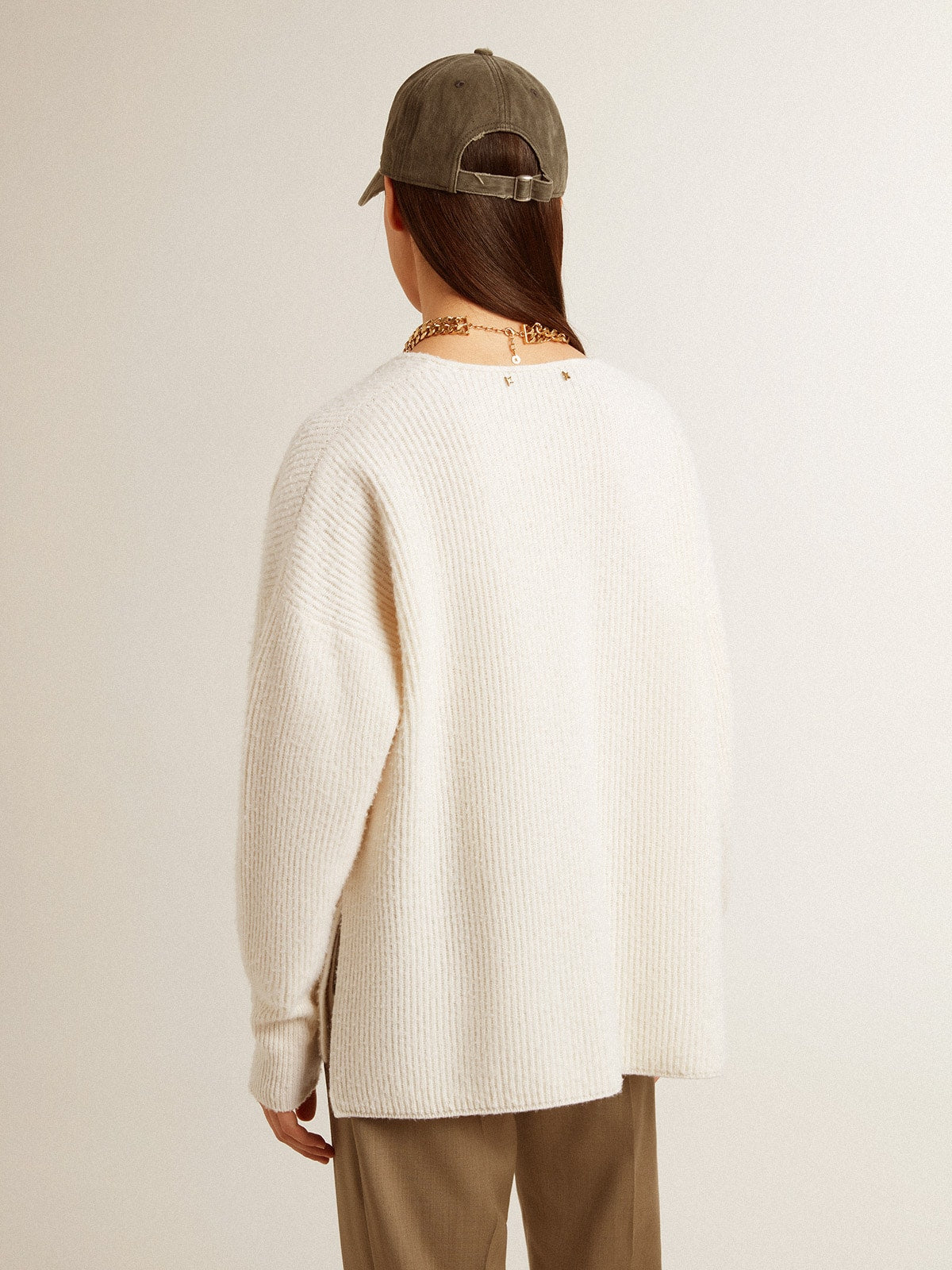 Ribbed wool sweater with V neck and drawstring with tassels
