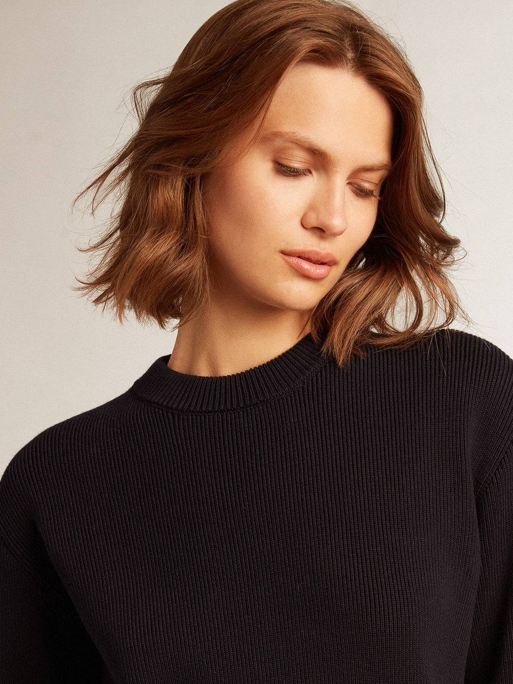 Women’s round-neck sweater in dark blue cotton with logo on the back