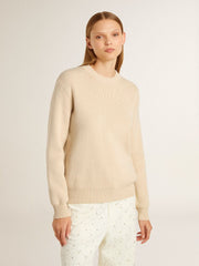 Women's beige sweater with 'Golden' lettering on the back