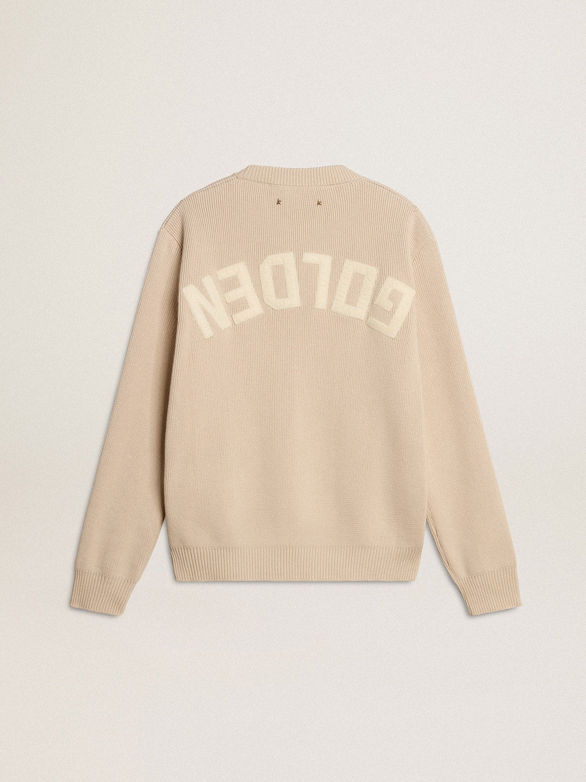 Women's beige sweater with 'Golden' lettering on the back
